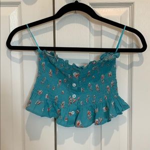 ruffle tube top with buttons and flower detail
